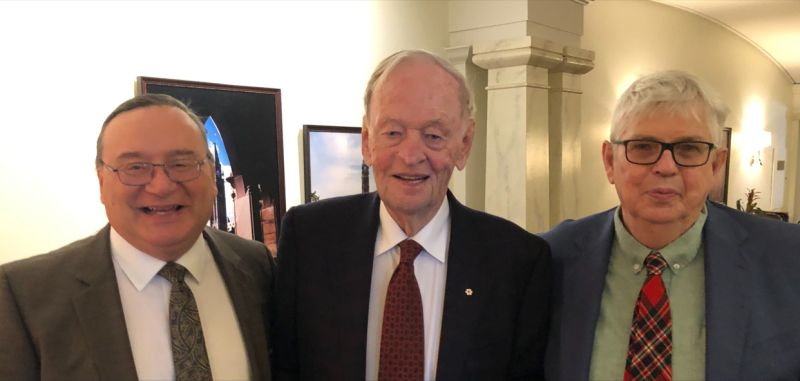 A photo containing Wayne Garnons-Williams, former Canadian Prime Minister Jean Chrétien & Michael Woods standing side by side.